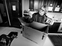 Melissa Mann goes through the food items donated by Stop n Shop to the Veterans Transition House currently housed at the rectory of the now closed St. John church on County Street in New Bedford, MA. A new building is scheduled tol be constructed in 2019.   PHOTO PETER PEREIRA